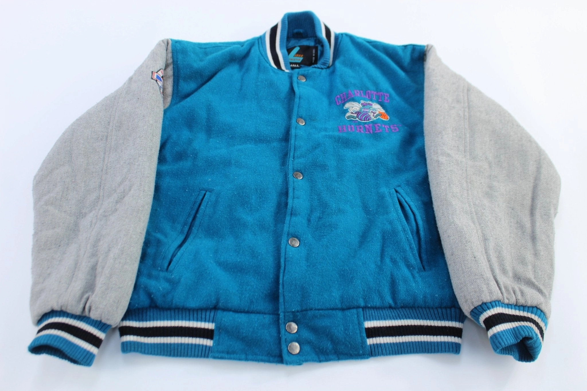 Compact Packable Multi Pocket Configuration 90's Charlotte Hornets Embroidered Logo 7 Varsity Jacket