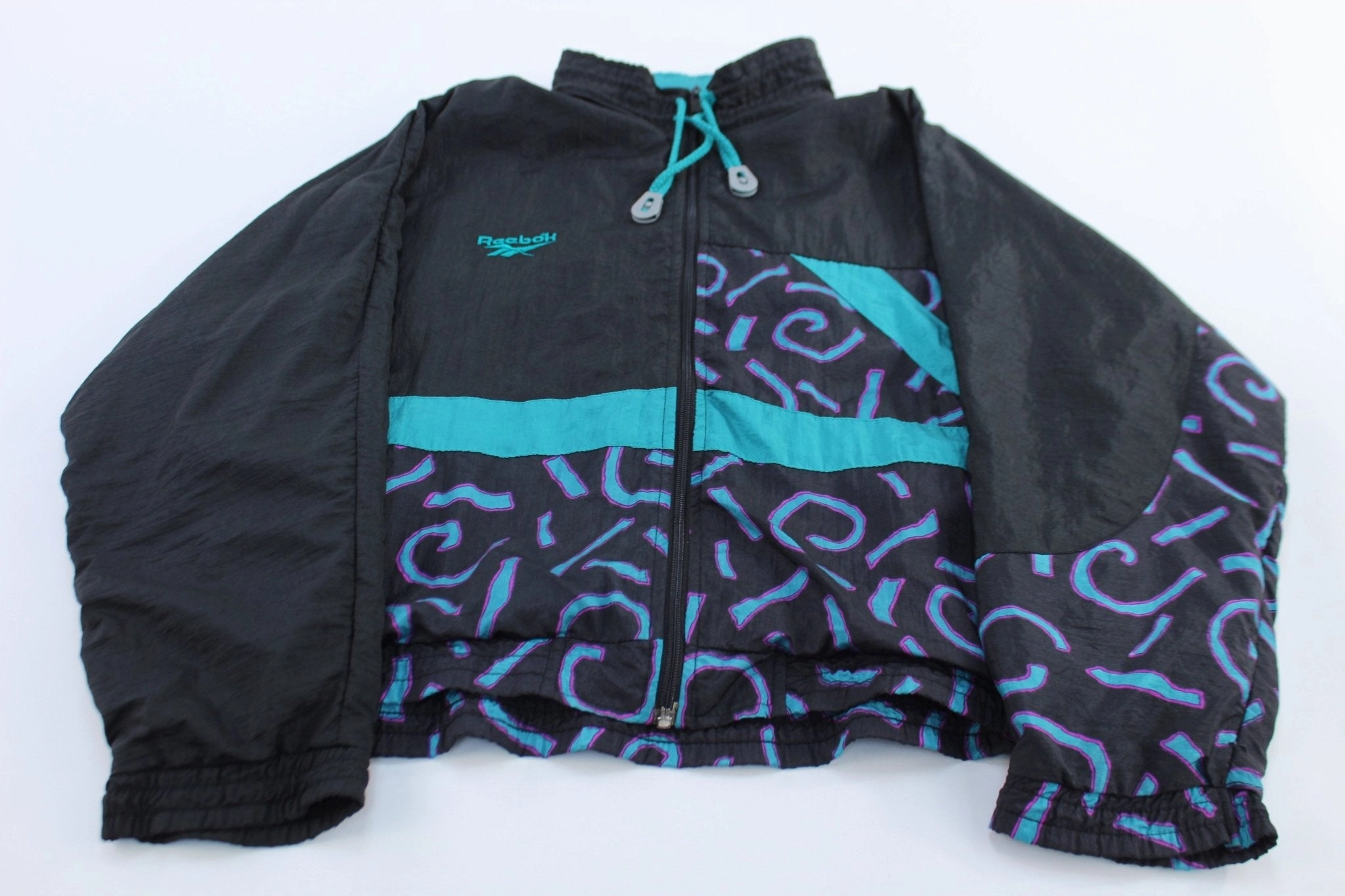 Women's 90's Reebok Embroidered Logo Abstract Windbreaker Jacket Water-Resistant Protection Quality Assurance